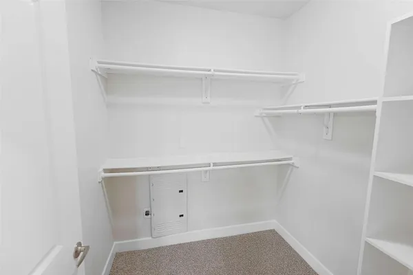 a view of an empty walk in closet