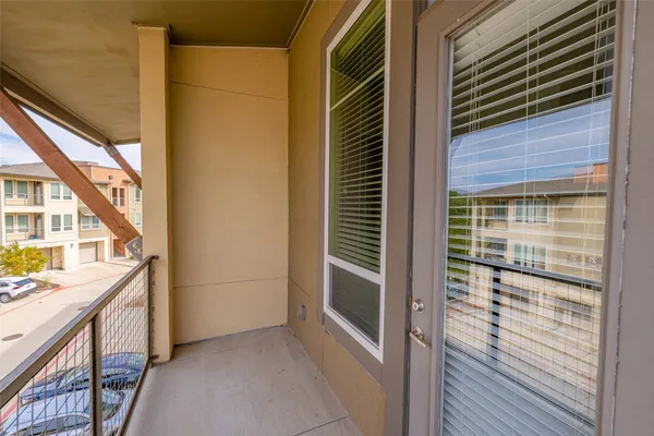 a view of balcony and wooden floor