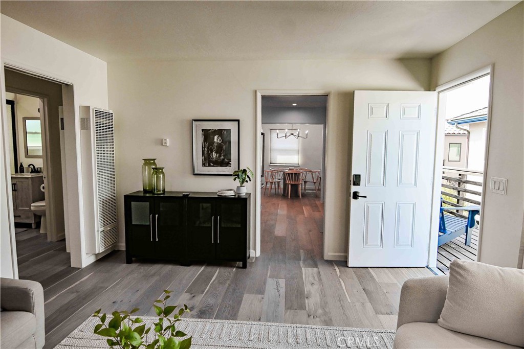 56 Gracia Avenue Cayucos, CA 93430 - Photo 11 of 12 a living room with furniture and a wooden floor