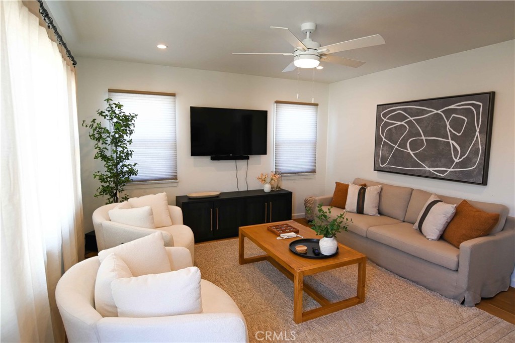 56 Gracia Avenue Cayucos, CA 93430 - Photo 10 of 12 a living room with furniture and a flat screen tv