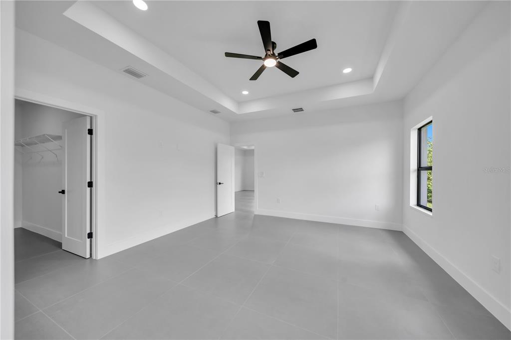 2328 Irondale Road North Port, FL 34287 - Photo 19 of 45 a view of a livingroom with a ceiling fan and window