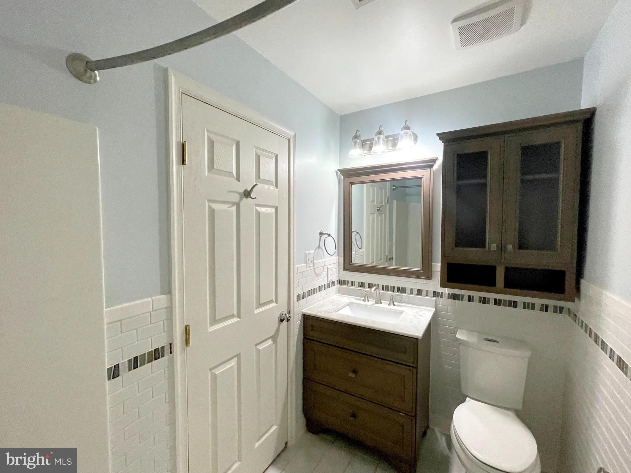 20871 Freedom Run Drive Lexington Park, MD 20653 - Photo 31 of 61 a bathroom with a toilet sink and mirror