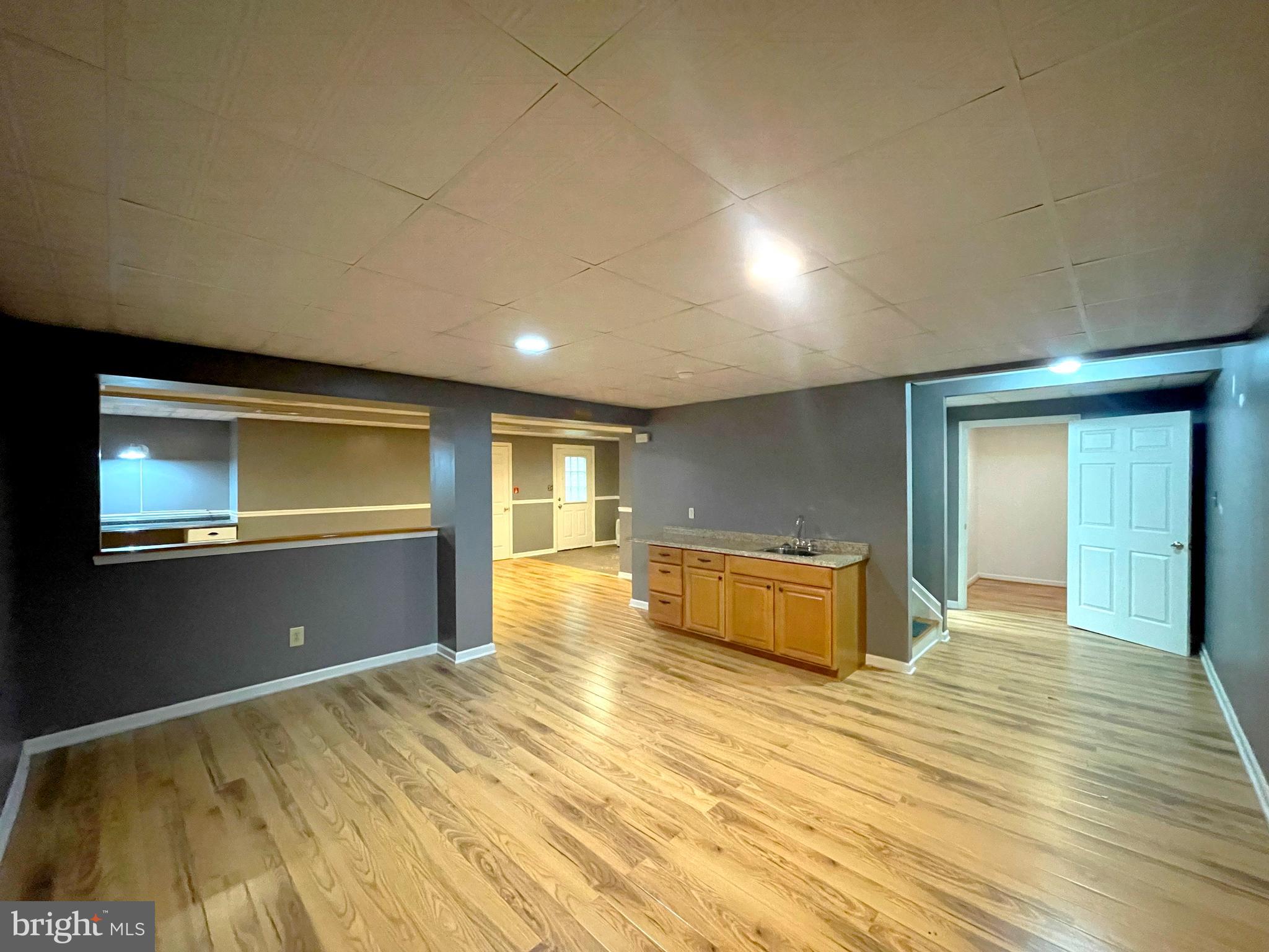 20871 Freedom Run Drive Lexington Park, MD 20653 - Photo 40 of 61 a view of an empty room with kitchen and a window