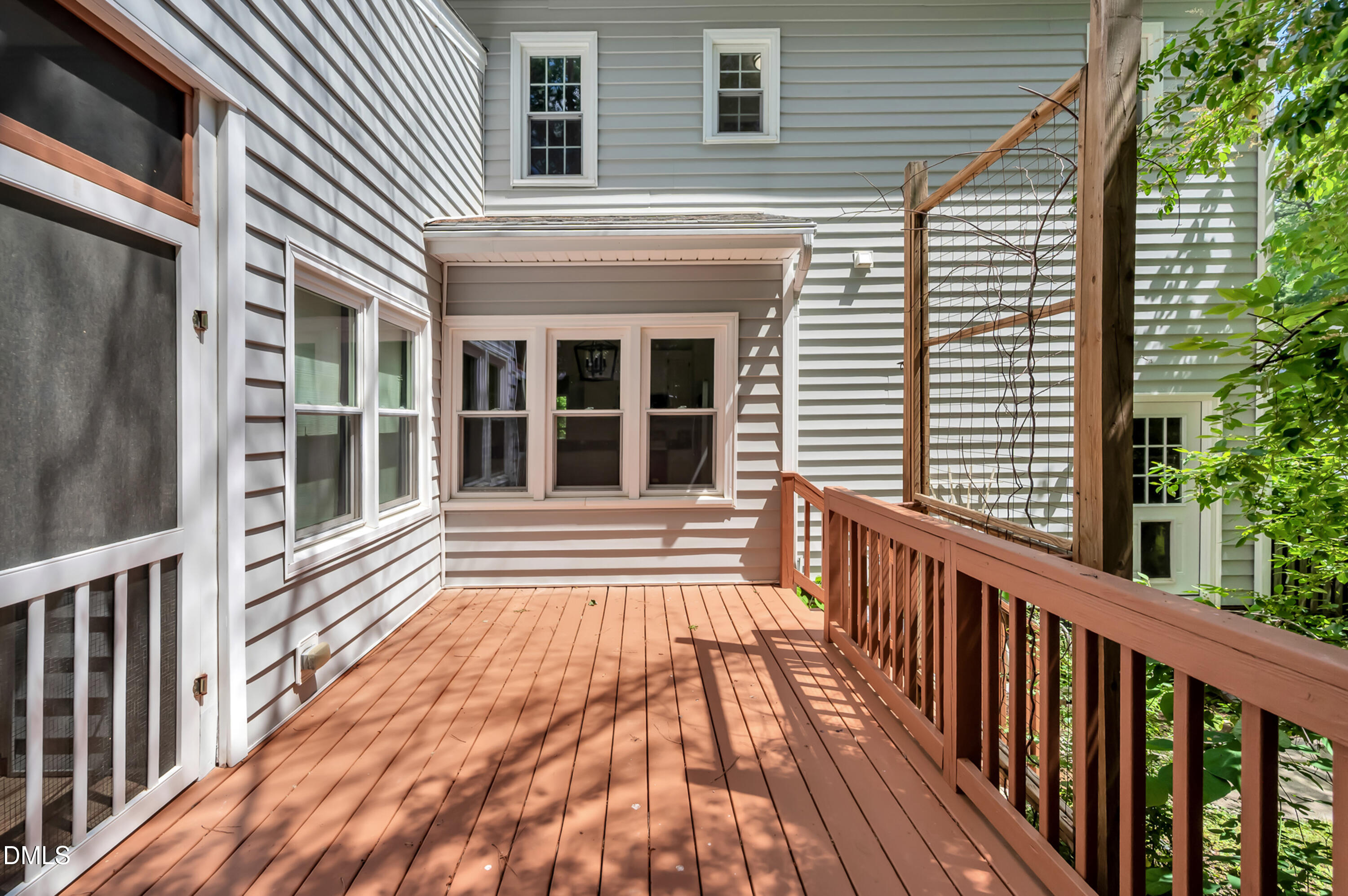 7500 Drayton Court Raleigh, NC 27615 - Photo 21 of 27 a view of a house with large windows and a stairs