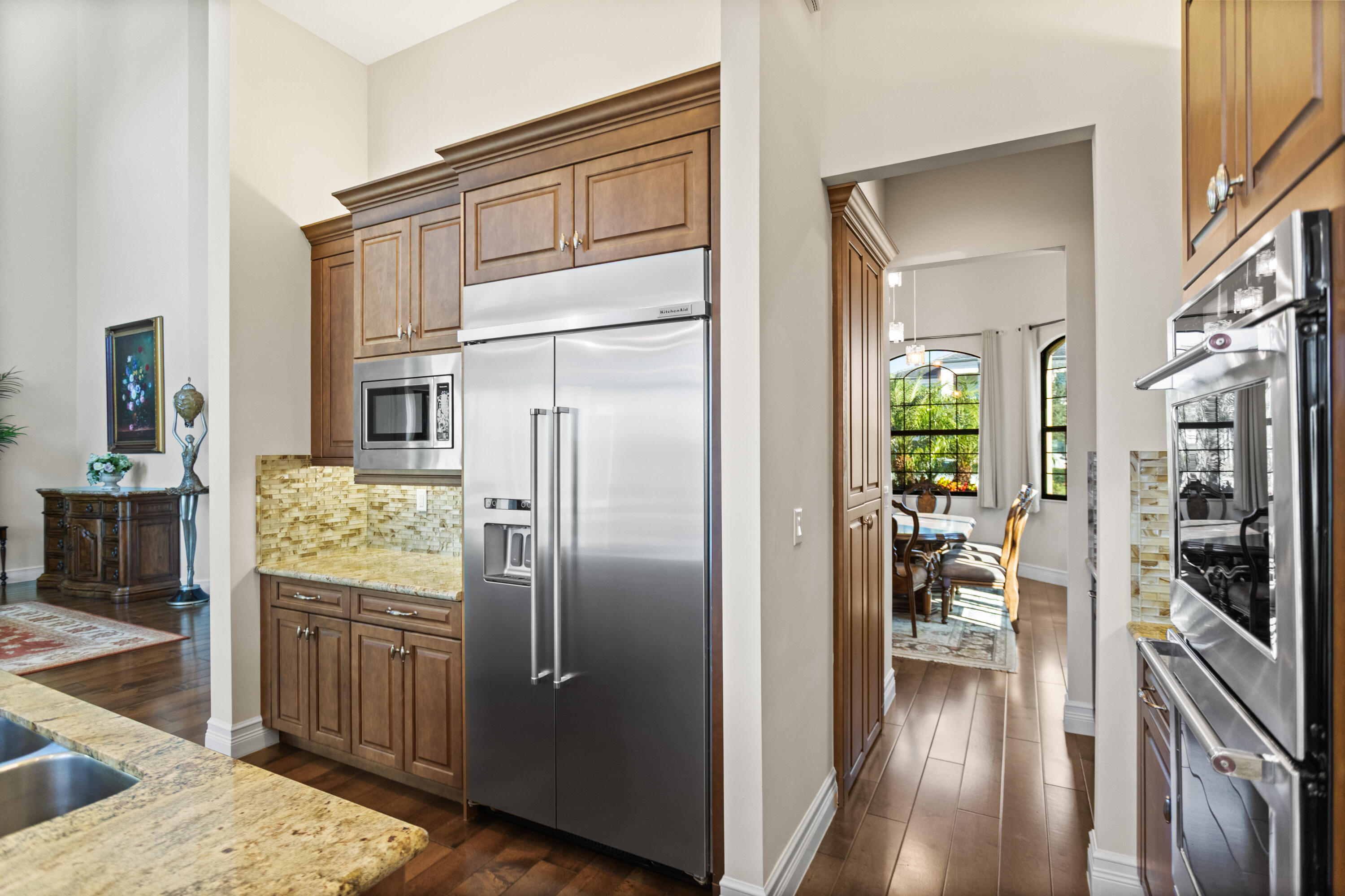 16743 Picardy Way Delray Beach, FL 33446 - Photo 11 of 79 a kitchen with stainless steel appliances a refrigerator and a stove top oven