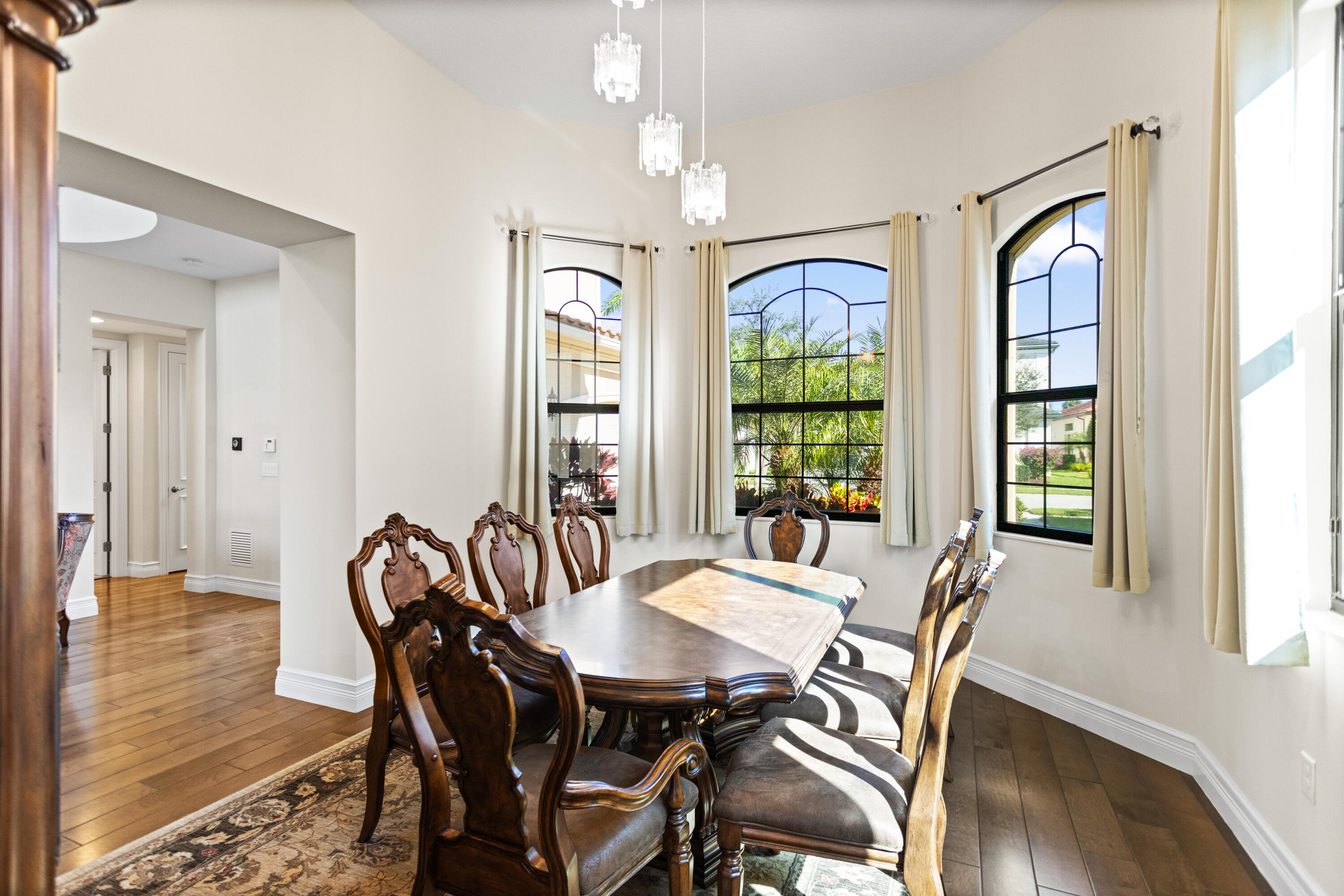 16743 Picardy Way Delray Beach, FL 33446 - Photo 15 of 79 a view of a dining room with furniture window and wooden floor