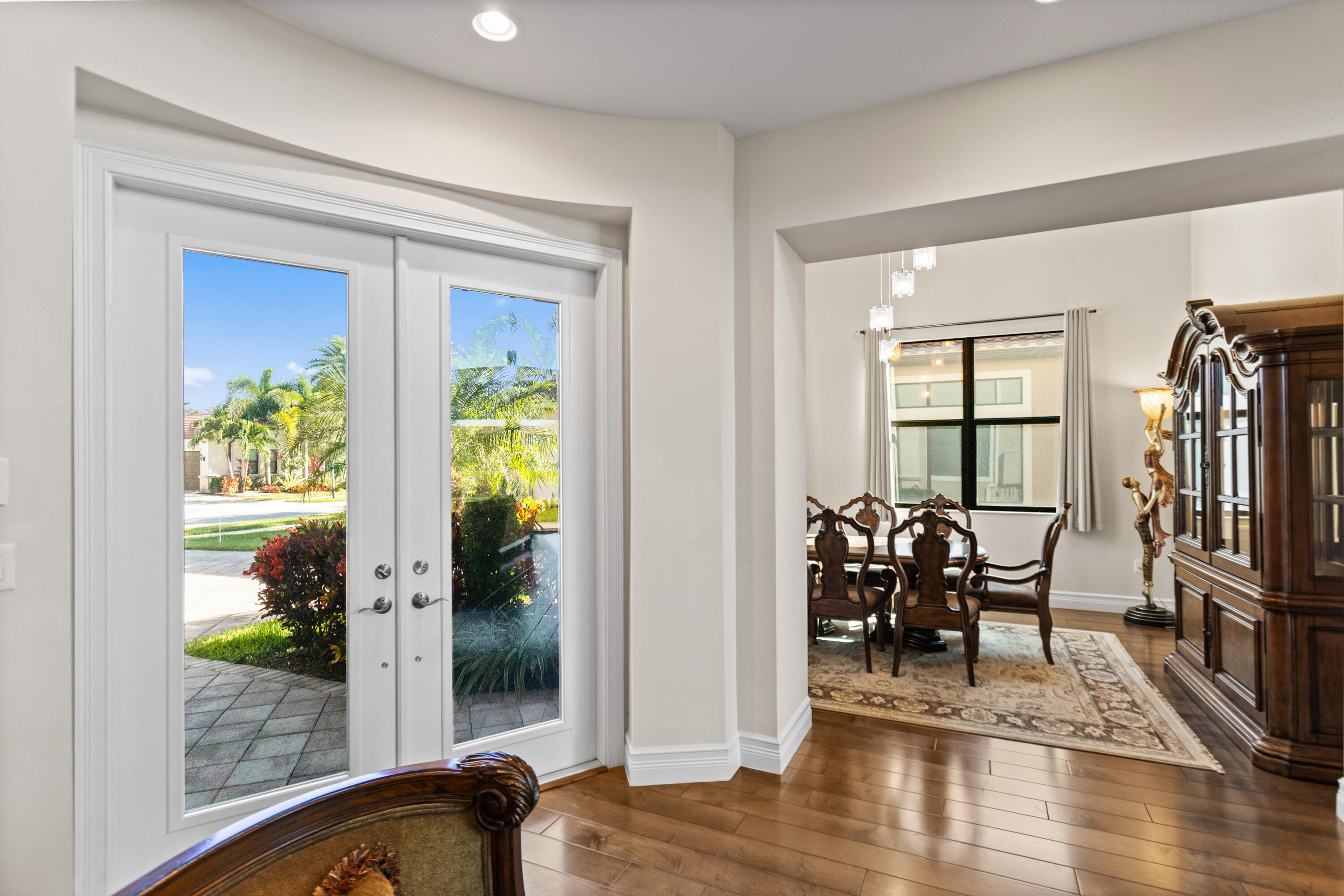 16743 Picardy Way Delray Beach, FL 33446 - Photo 18 of 79 a view of living room filled with furniture and a floor to ceiling window