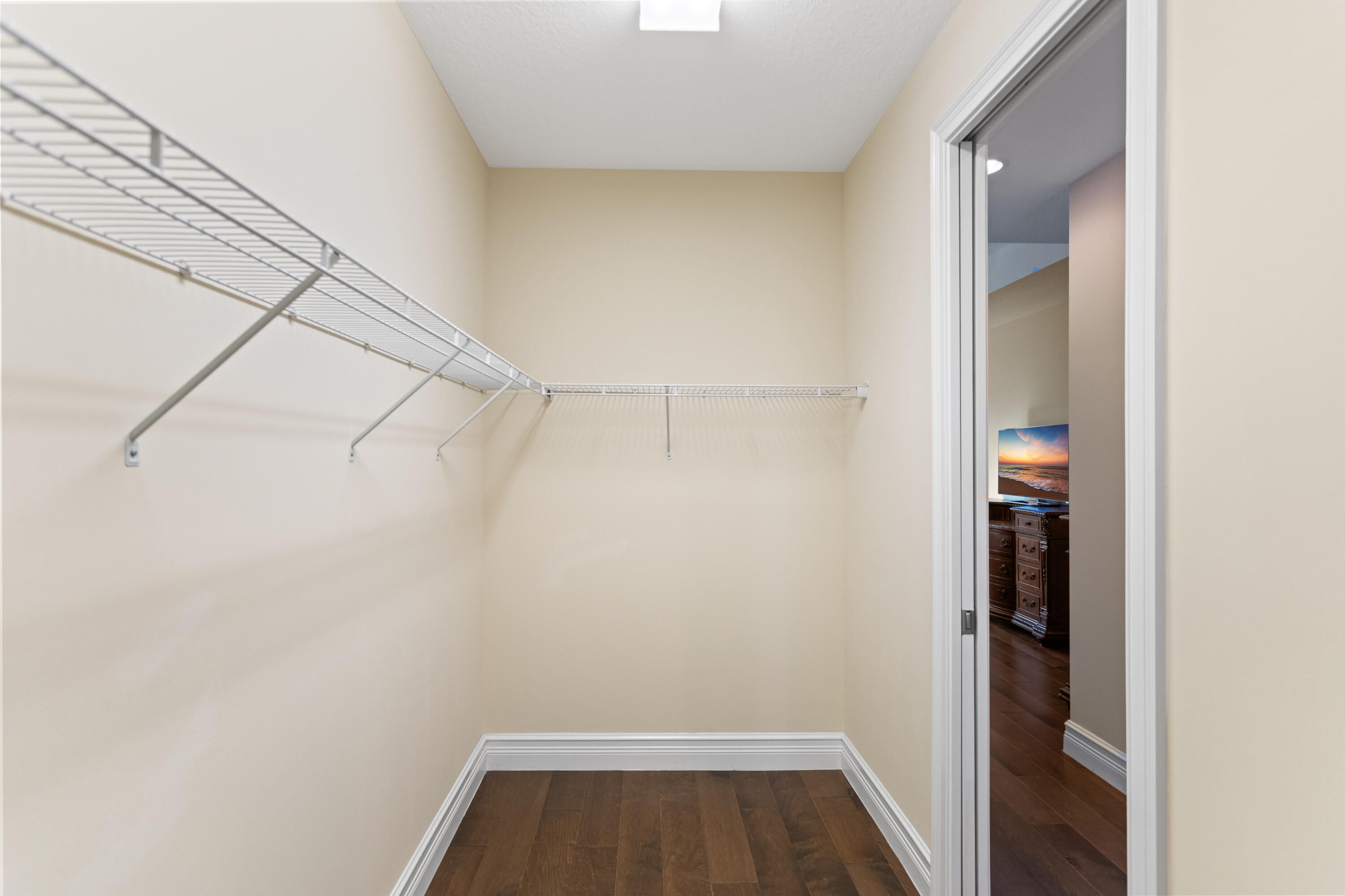 16743 Picardy Way Delray Beach, FL 33446 - Photo 27 of 79 a view of walk in closet with empty racks