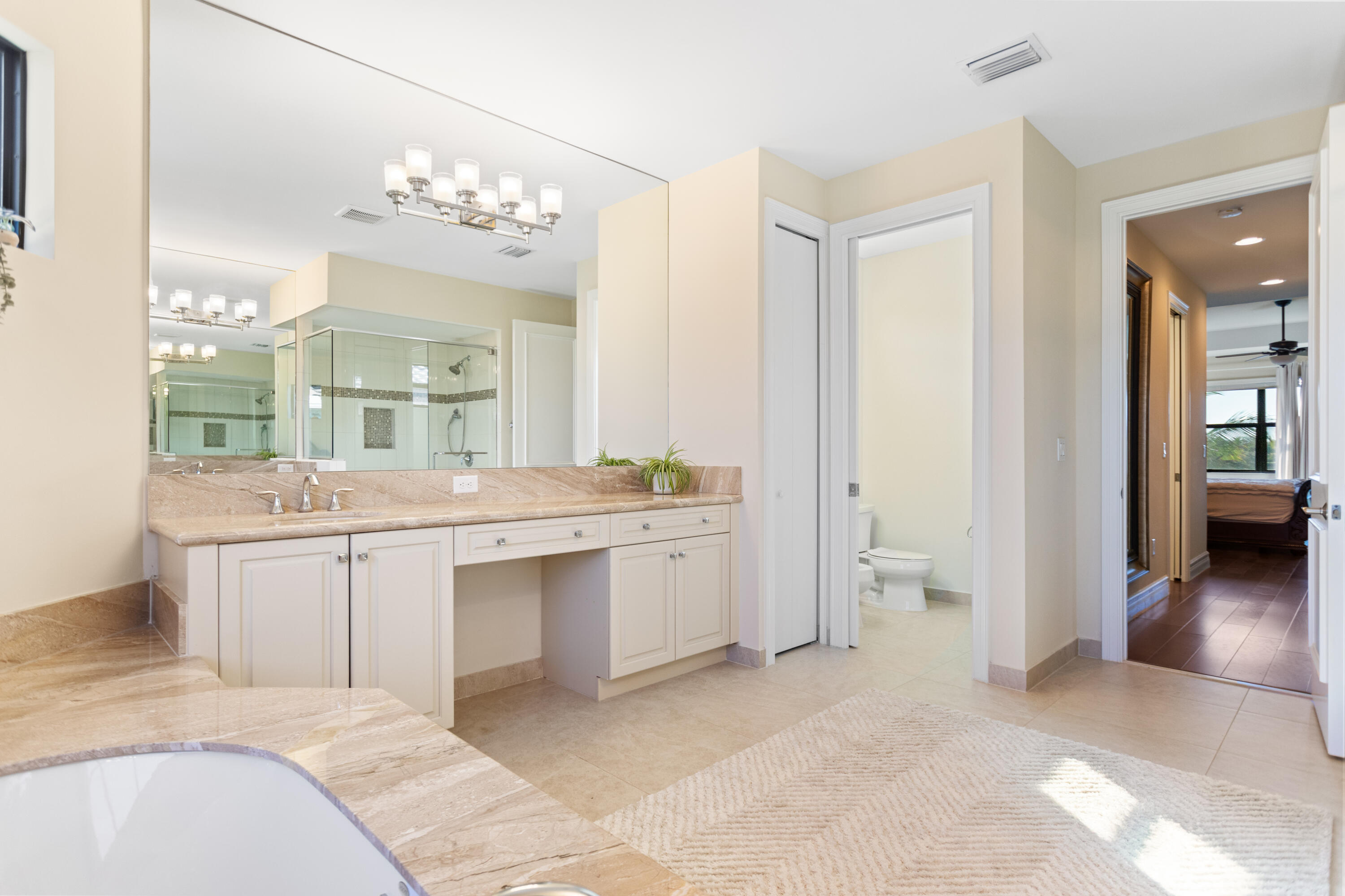 16743 Picardy Way Delray Beach, FL 33446 - Photo 30 of 79 a bathroom with a sink a vanity and a large mirror
