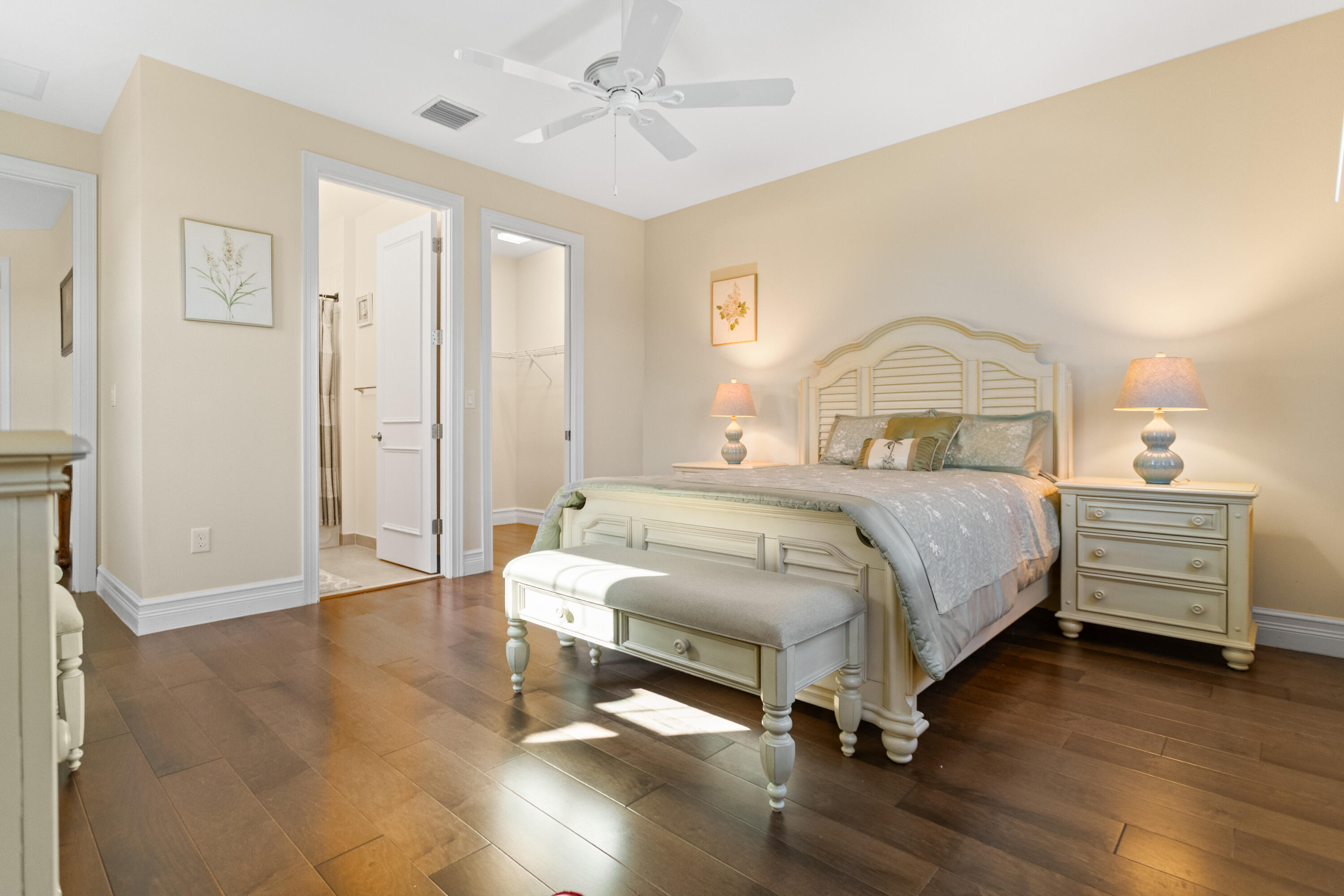 16743 Picardy Way Delray Beach, FL 33446 - Photo 37 of 79 a bedroom with a bed and a dresser with wooden floor