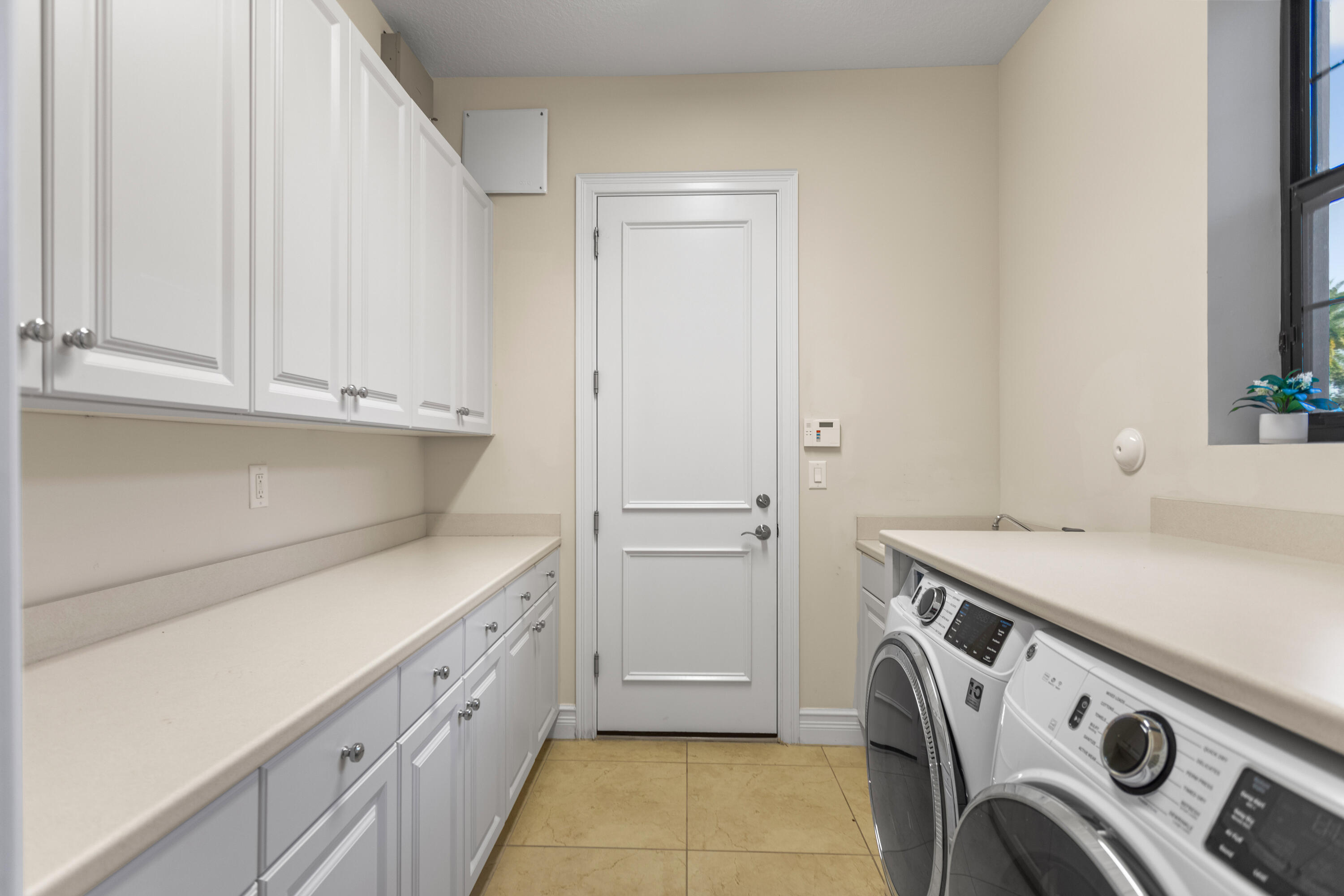 16743 Picardy Way Delray Beach, FL 33446 - Photo 44 of 79 a utility room with dryer and washer