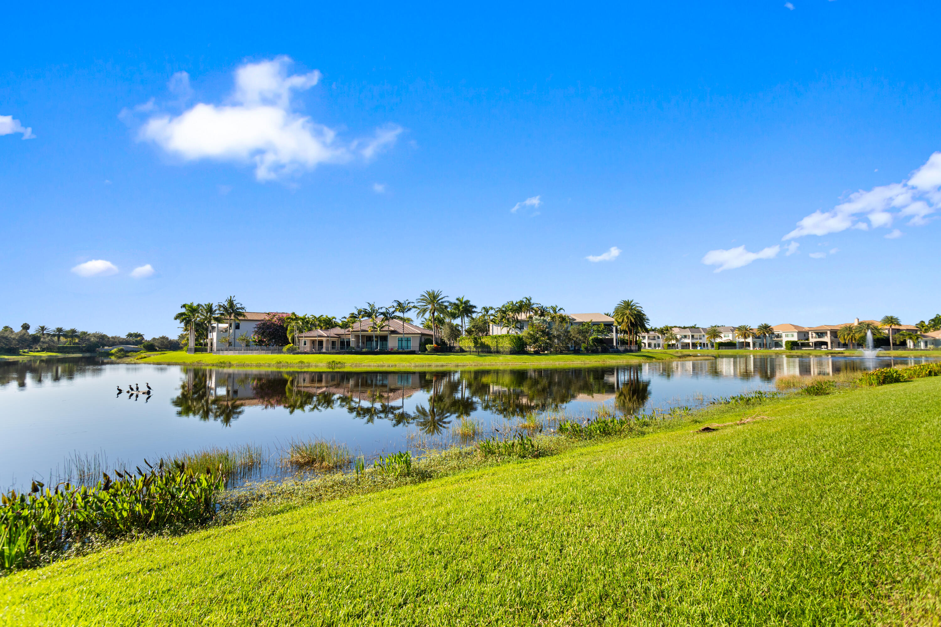 16743 Picardy Way Delray Beach, FL 33446 - Photo 49 of 79 a view of a lake with houses in the back