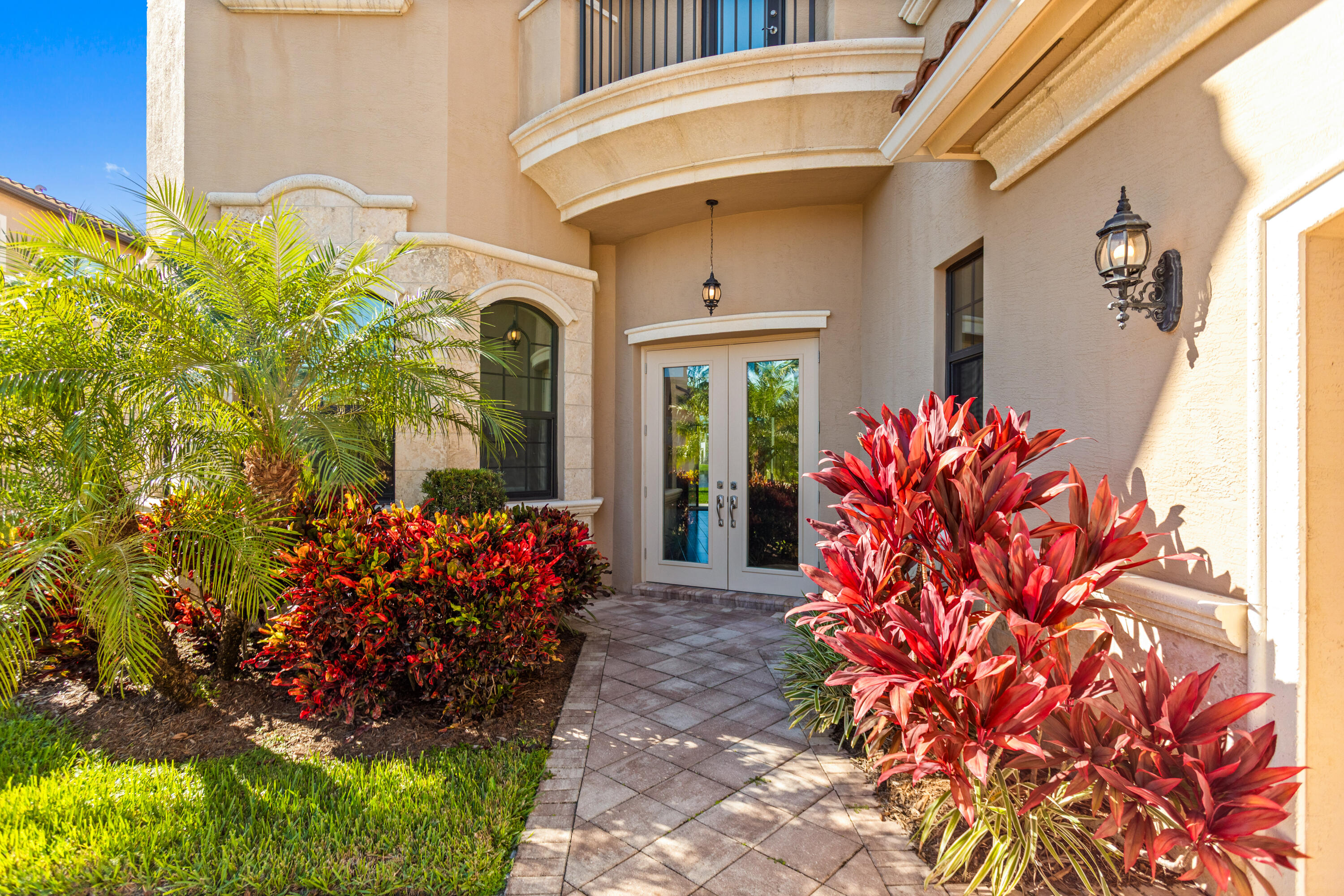 16743 Picardy Way Delray Beach, FL 33446 - Photo 7 of 79 a vase of flowers sitting in front of a door
