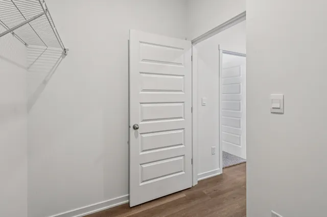 a view of kitchen with stainless steel appliances granite countertop a stove top oven a sink and a microwave