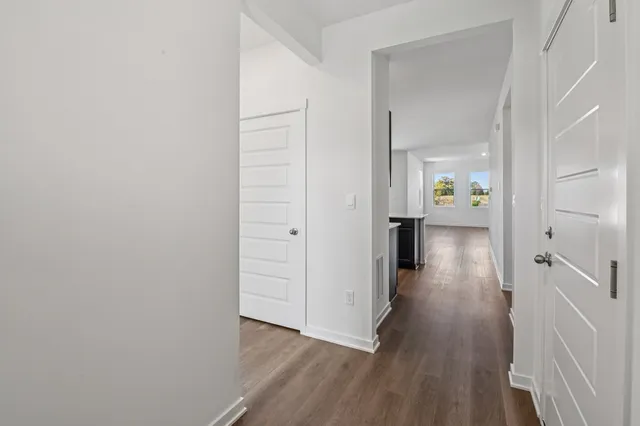 a view of an empty room and closet area