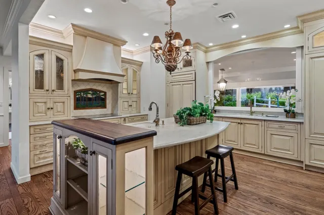 a kitchen with a table and chairs in it