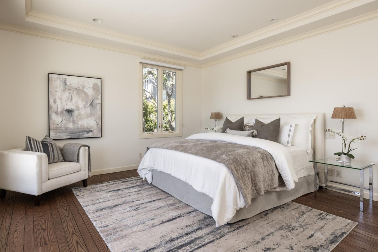 3307 17 Mile Drive, Unit 3 Pebble Beach, CA 93953 - Photo 16 of 42 a spacious bedroom with a bed and a couch