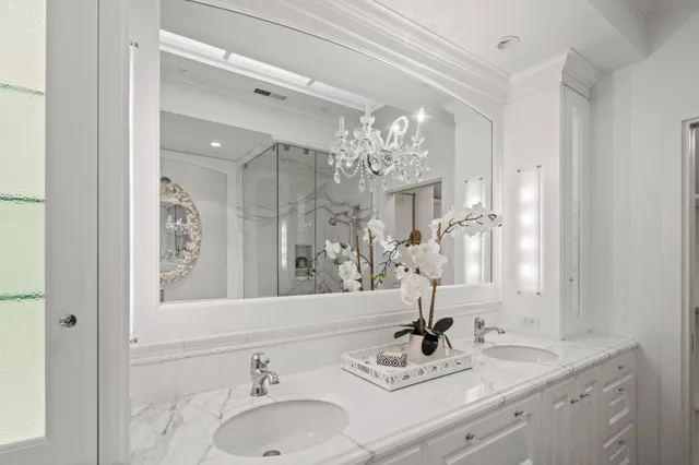 a bathroom with a sink double vanity and a mirror