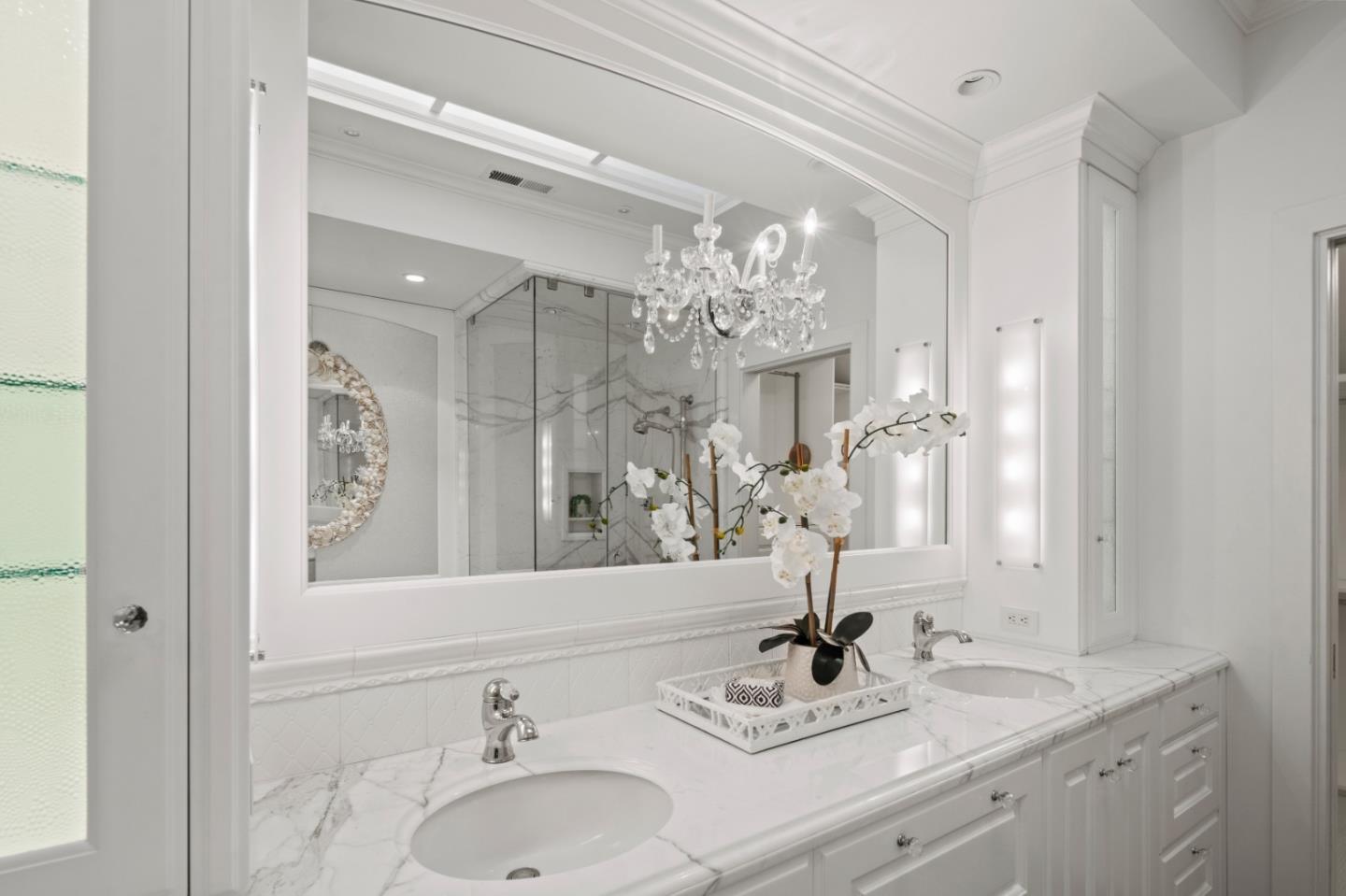 3307 17 Mile Drive, Unit 3 Pebble Beach, CA 93953 - Photo 18 of 42 a bathroom with a sink double vanity and a mirror