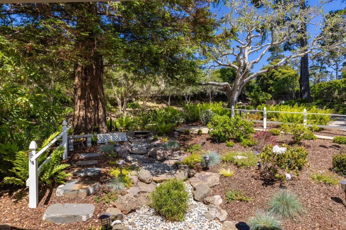 3307 17 Mile Drive, Unit 3 Pebble Beach, CA 93953 - Photo 30 of 42 a view of a tree with a yard