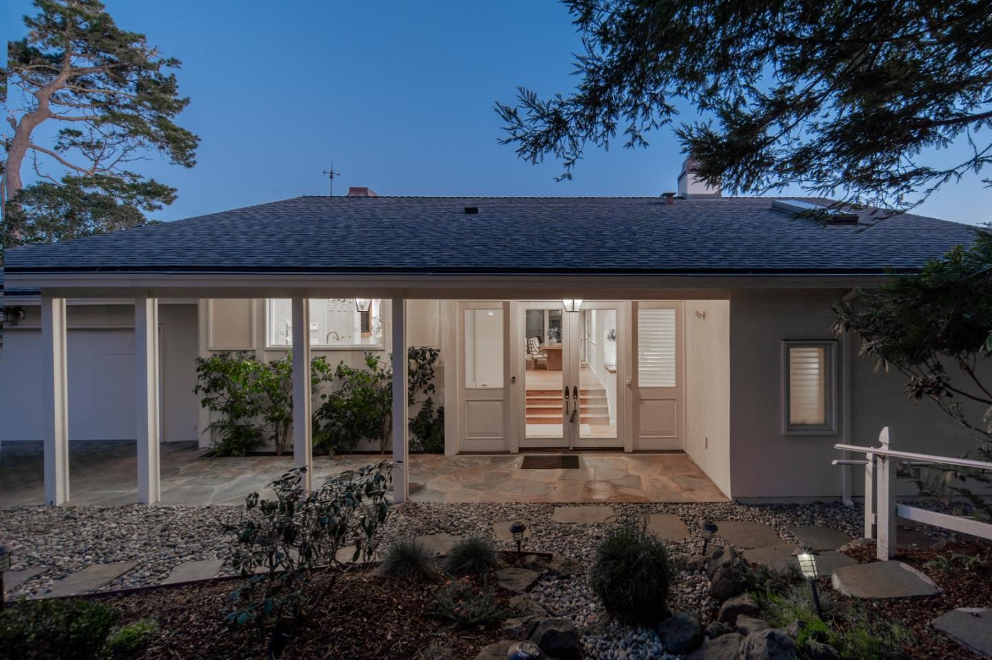 3307 17 Mile Drive, Unit 3 Pebble Beach, CA 93953 - Photo 35 of 42 a view of a house with backyard and porch