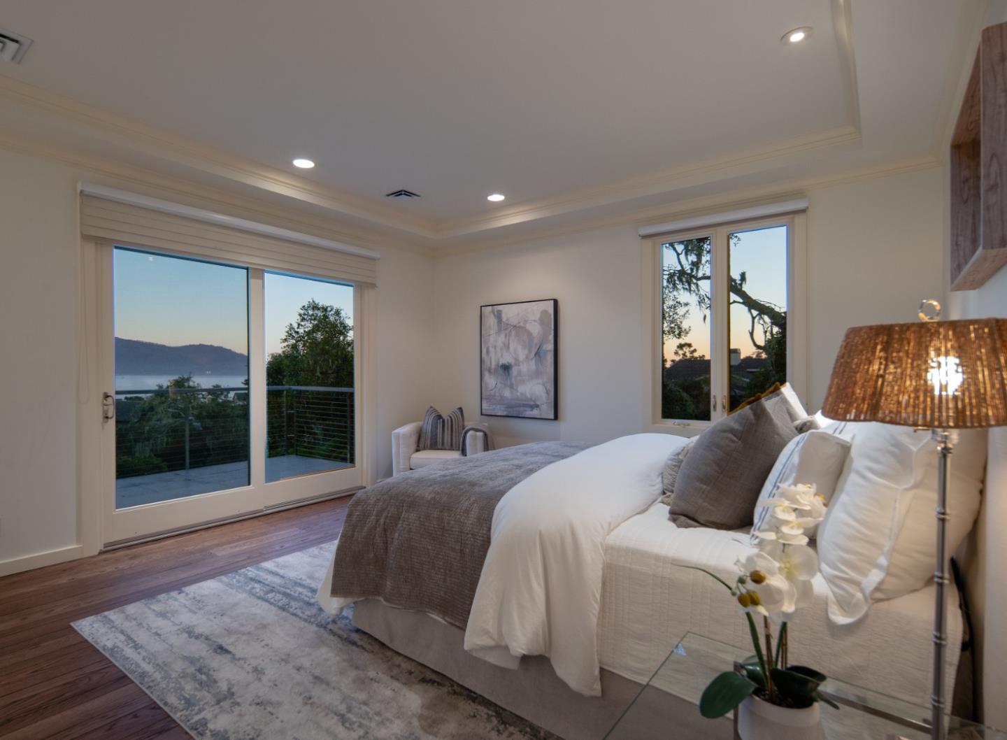 3307 17 Mile Drive, Unit 3 Pebble Beach, CA 93953 - Photo 39 of 42 a bedroom with a bed and glass window