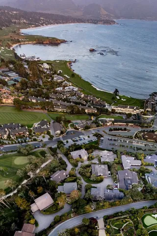 an aerial view of residential building and lake
