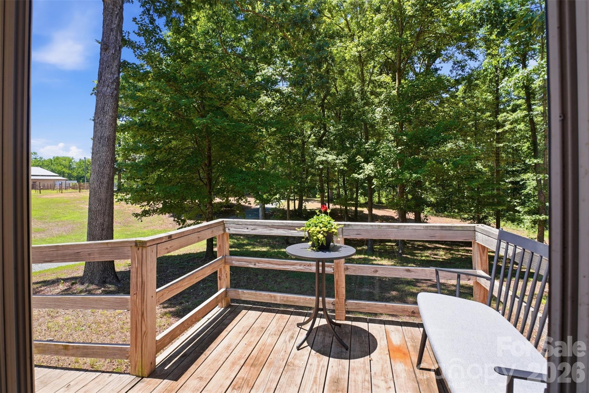 4406 Lucy Short Cut Road Marshville, NC 28103 - Photo 5 of 30 a view of a chairs and table in the balcony