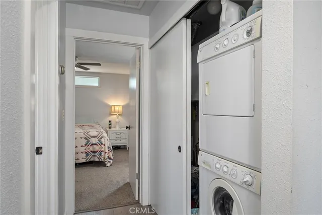 a view of bedroom with washer and dryer