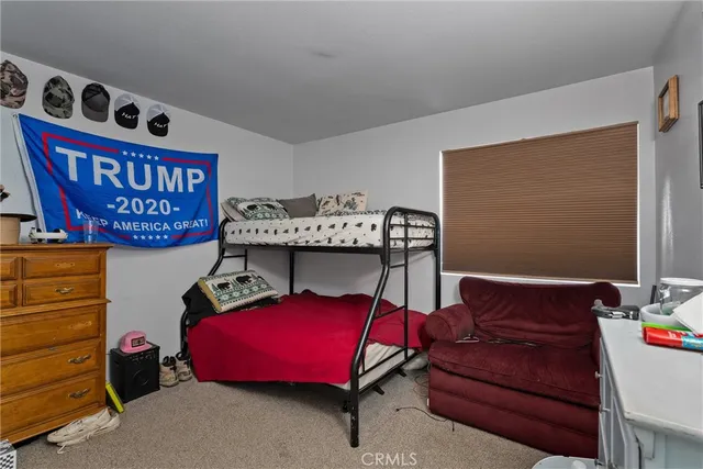 a bedroom with a bed and a closet