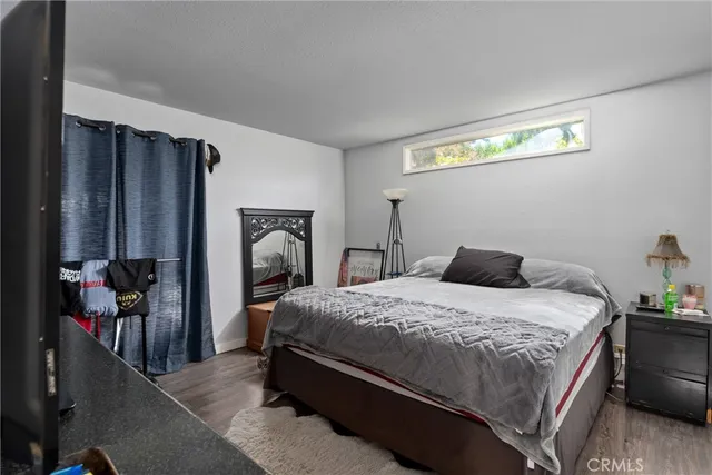 a living room with patio furniture and a potted plants