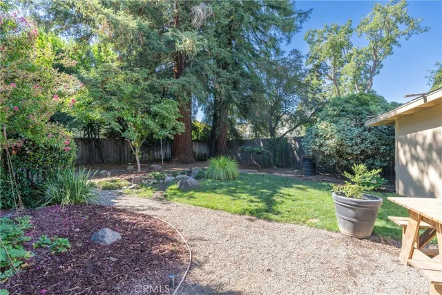 a view of a backyard with sitting area