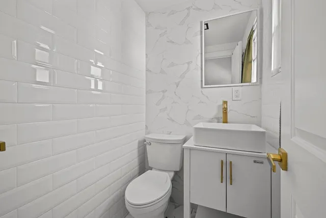 a kitchen with stainless steel appliances a refrigerator a stove and a sink