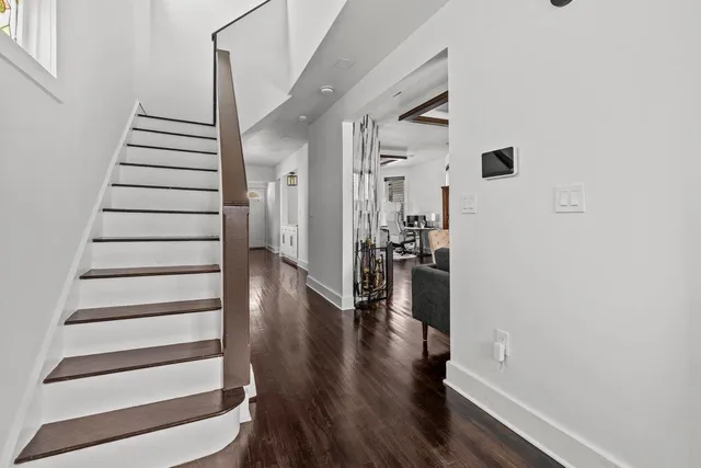 a kitchen with stainless steel appliances a sink stove and cabinets