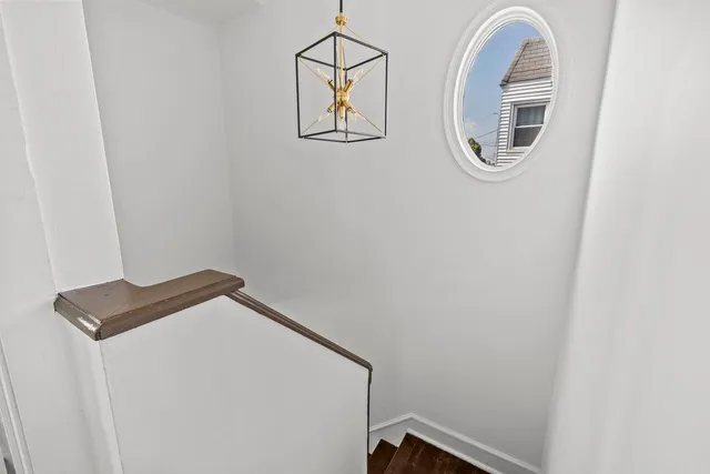 a white toilet sitting next to a bathroom sink