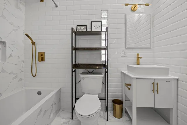 a kitchen with stainless steel appliances a sink stove and cabinets