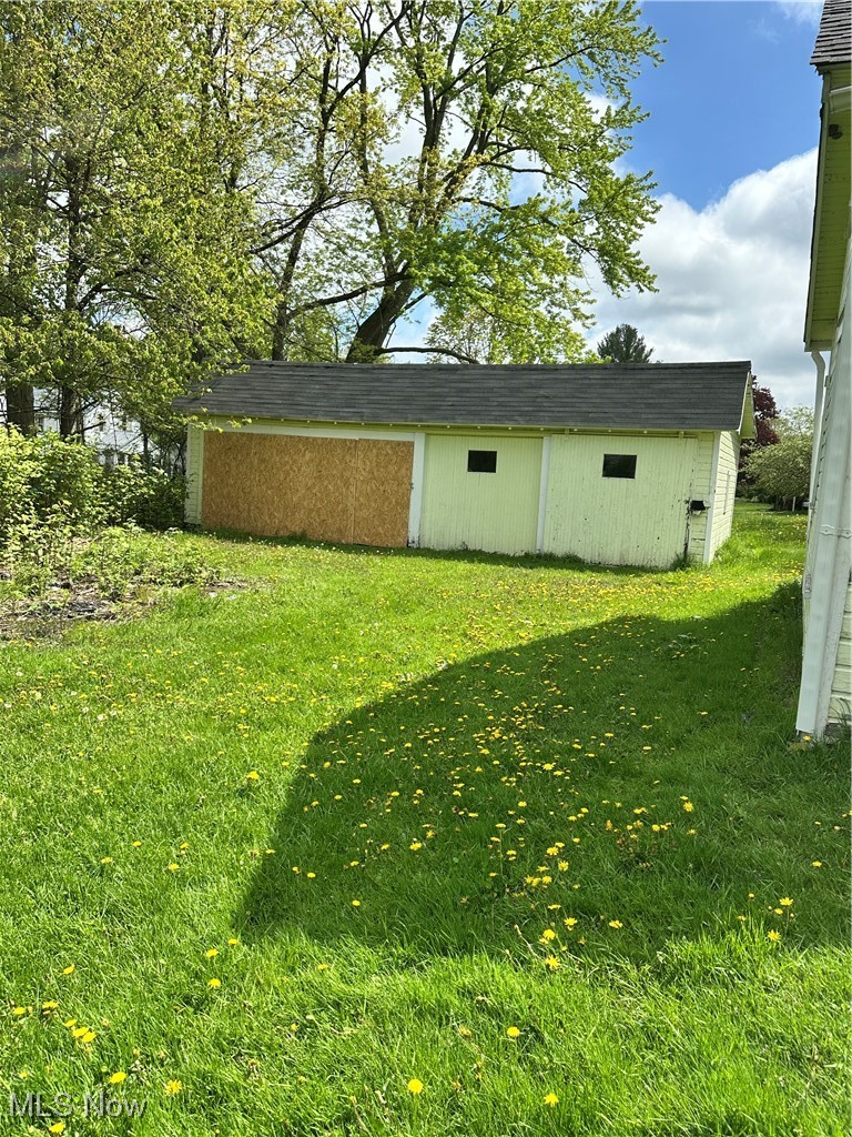 6144 Jefferson Road Ashtabula, OH 44004 - Photo 30 of 30 View of green lawn featuring an outbuilding