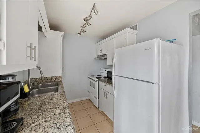 a view of room with window and workspace