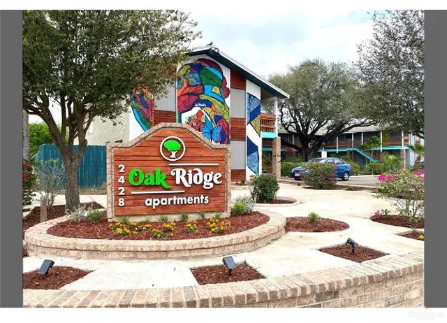 a view of outdoor space with signage and flags