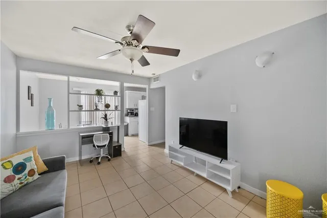 a view of a door with a small yard