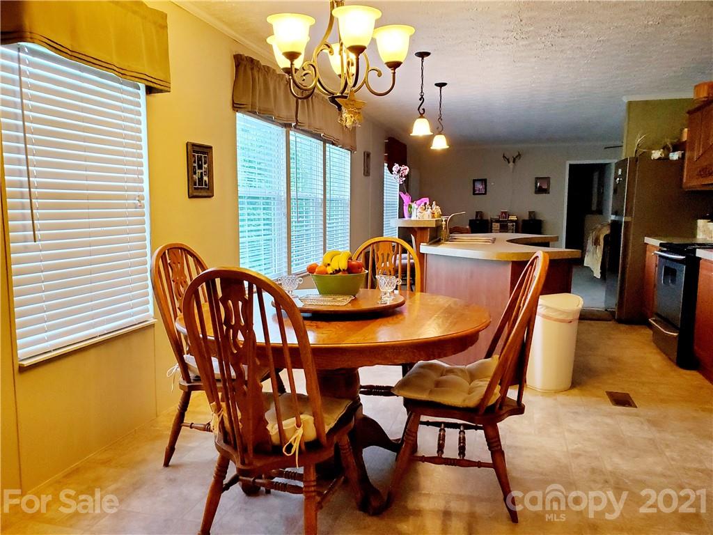 655 Sandy Bottom Road Marshall, NC 28753 - Photo 8 of 29 a view of a dining room with furniture