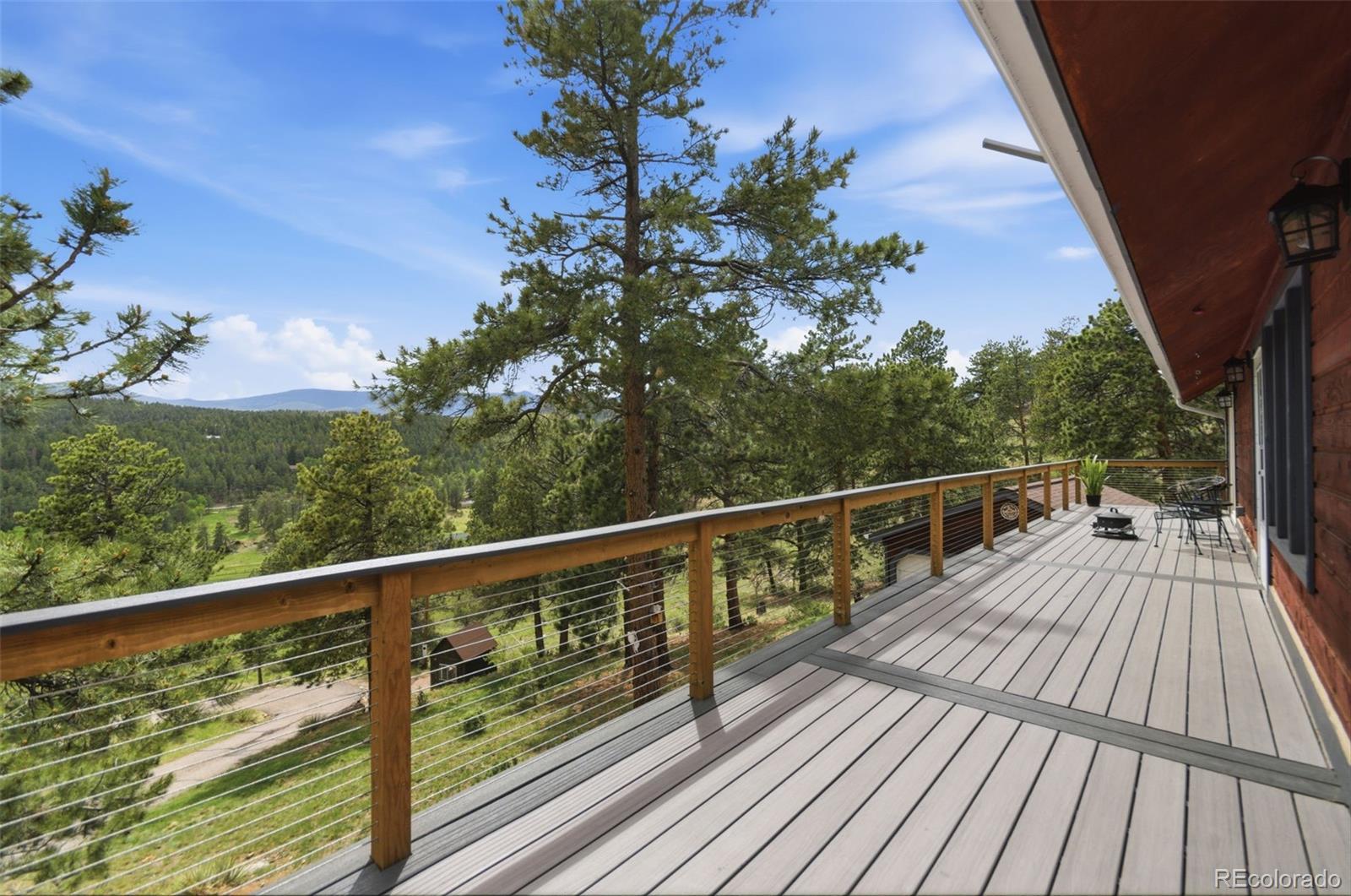 202 Badger Lane Bailey, CO 80421 - Photo 19 of 50 a view of balcony with wooden floor and fence