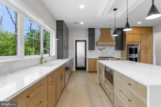 a kitchen with a stove and a white cabinet