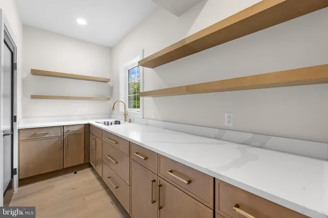 a kitchen with a sink and a refrigerator