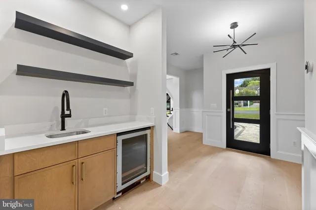 a view of staircase with white walls and a window