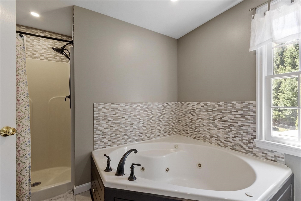 4 Ridge Road Pepperell, MA 01463 - Photo 24 of 42 a bathroom with a bathtub and shower