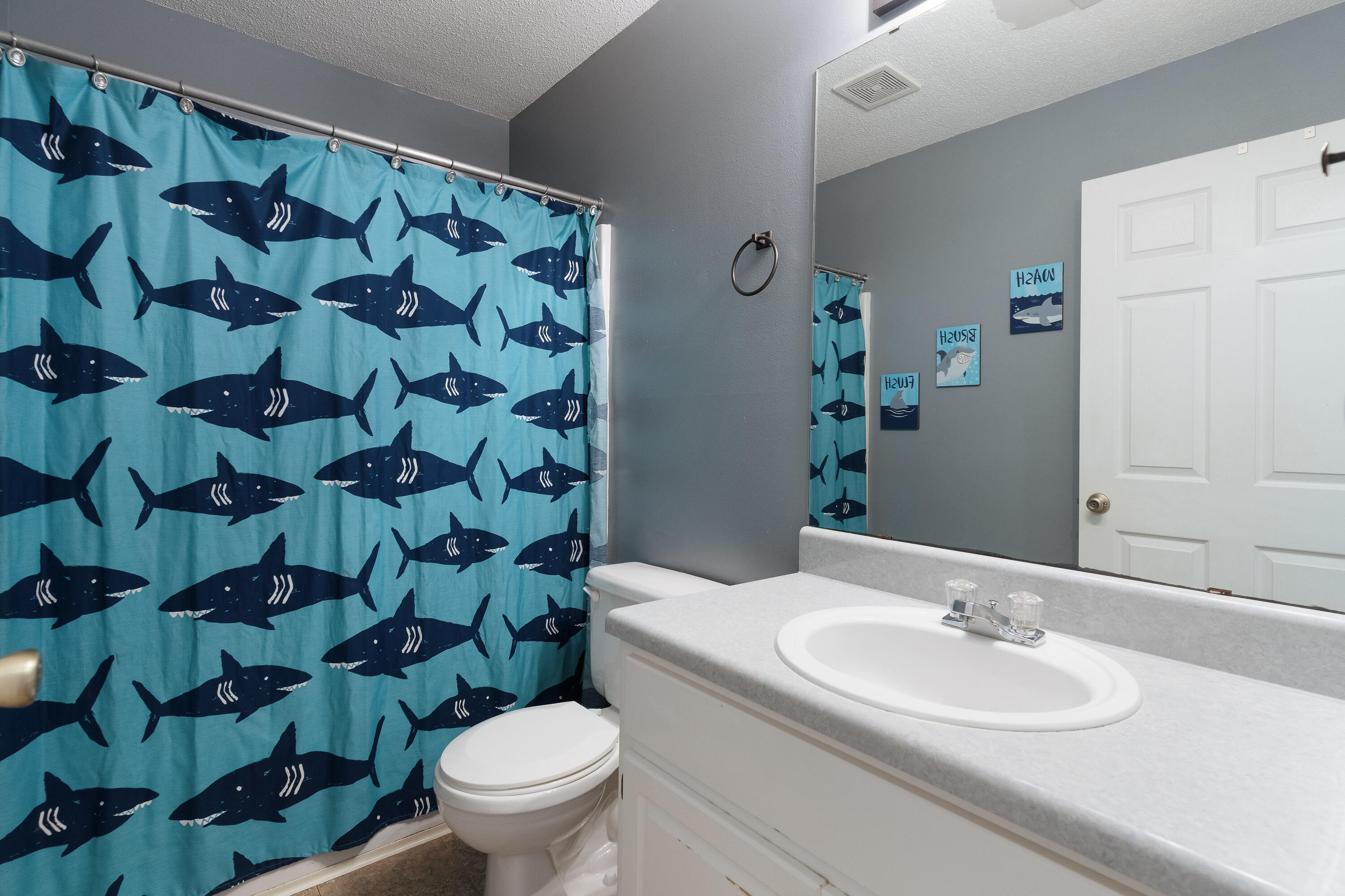 707 Riva Ridge Drive Crestview, FL 32539 - Photo 25 of 33 a bathroom with a sink and a toilet