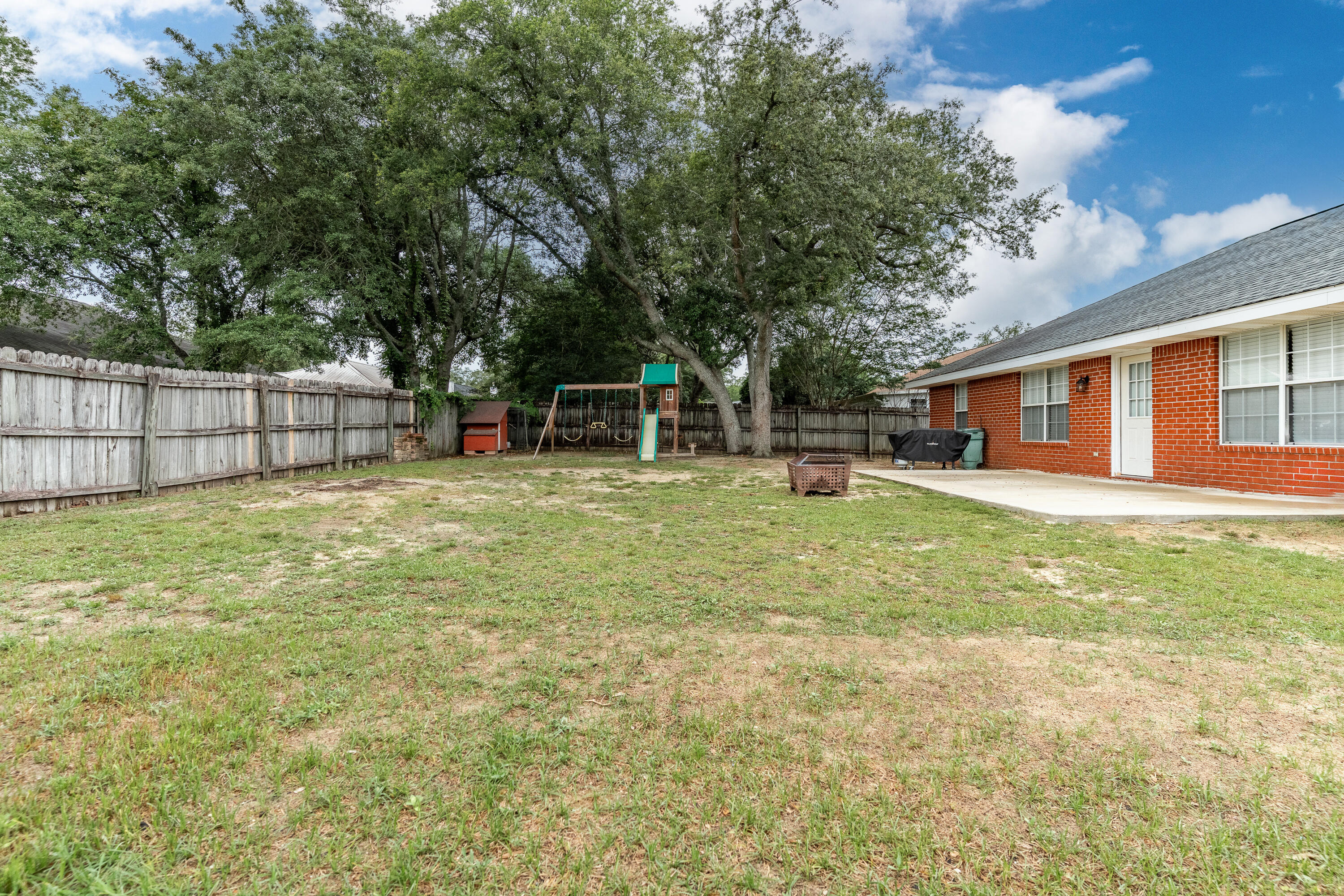 707 Riva Ridge Drive Crestview, FL 32539 - Photo 33 of 33 a view of a house with a yard and sitting area