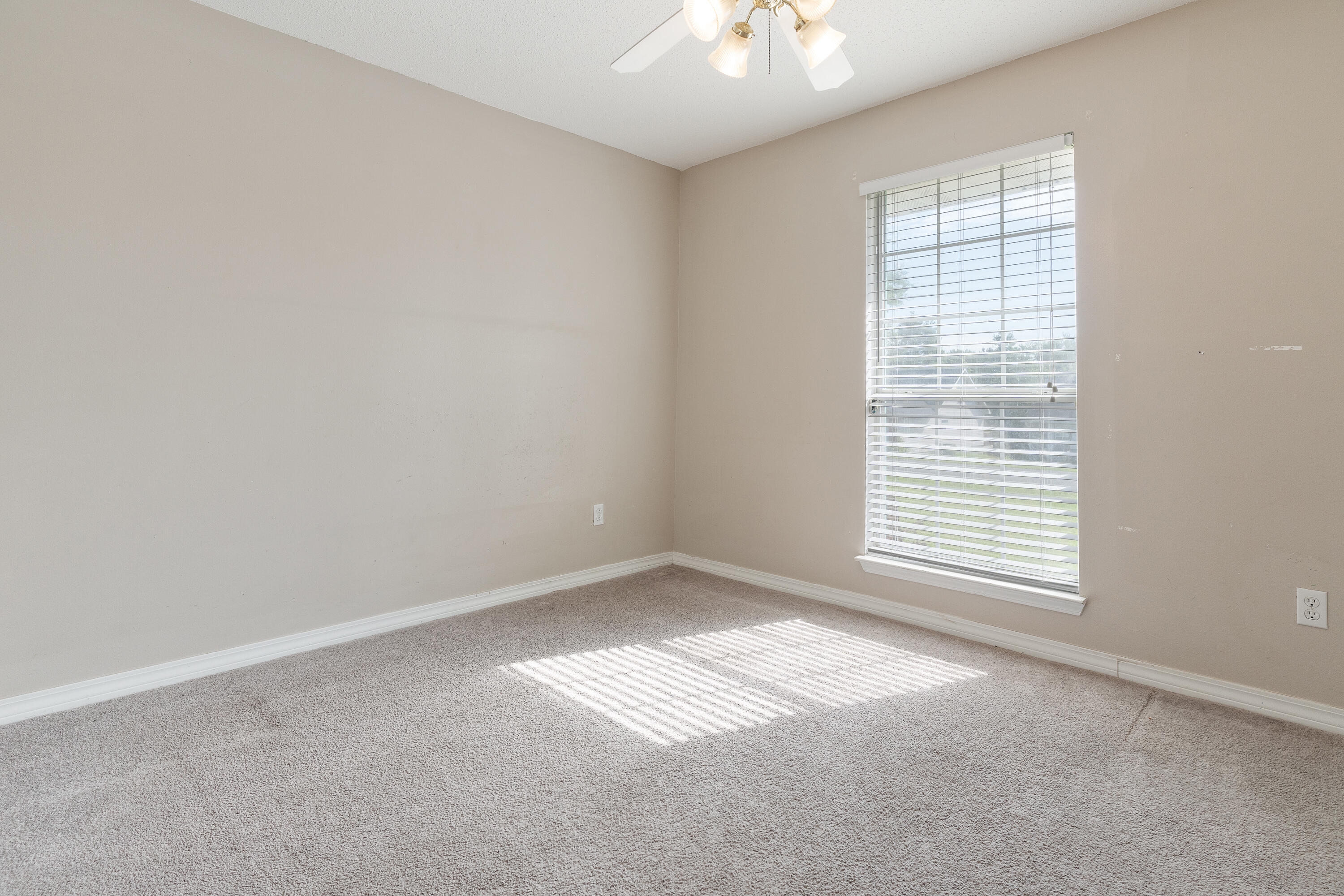 707 Riva Ridge Drive Crestview, FL 32539 - Photo 4 of 33 an empty room with a window