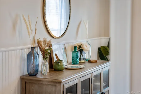 a kitchen with a sink and a mirror